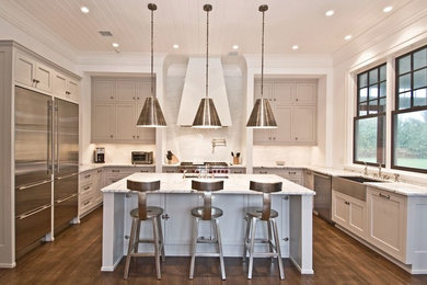 Eat-in kitchen - large modern u-shaped medium tone wood floor and brown floor eat-in kitchen idea in Other with an undermount sink, shaker cabinets, gray cabinets, marble countertops, white backsplash, ceramic backsplash, stainless steel appliances and an island