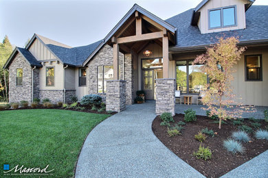 Huge arts and crafts beige two-story concrete fiberboard gable roof photo in Portland