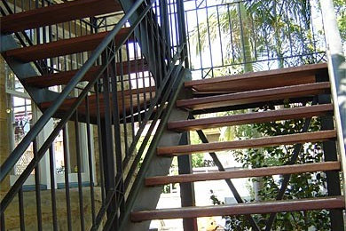 Design ideas for a large modern wood u-shaped staircase in Sydney with open risers.