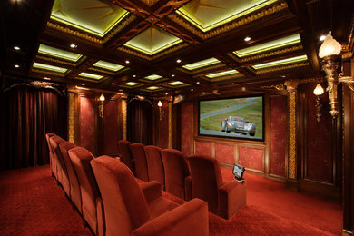 Large transitional enclosed carpeted and red floor home theater photo in San Diego with red walls and a projector screen