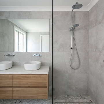 Bathroom with Herringbone floor tiles