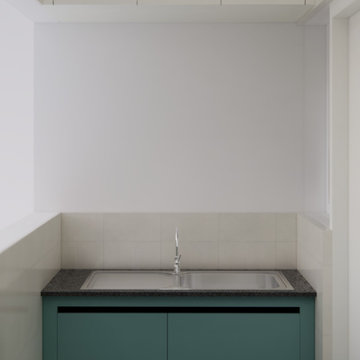 Utility Sink Area with Teal Cabinets & Top Units