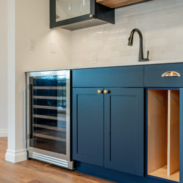 Modern Navy Wet Bar with Polished Brass Hardware and Wine Fridge