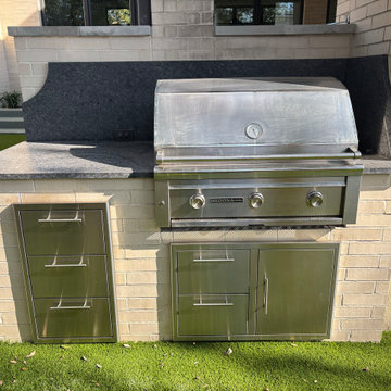 Stainless Steel Built-In Grill With Stone Counter and Storage