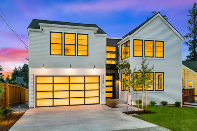 Design ideas for a large country two-storey white house exterior in Seattle with concrete fiberboard siding, a gable roof and a shingle roof.