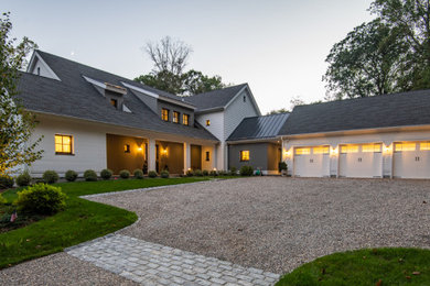 Cottage white two-story mixed siding house exterior idea in New York with a shingle roof