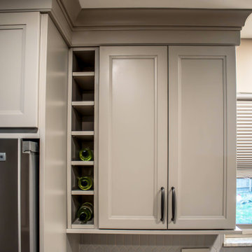 Two-Tone Neutral Kitchen with Quartz Countertop and Soho Picket Backsplash