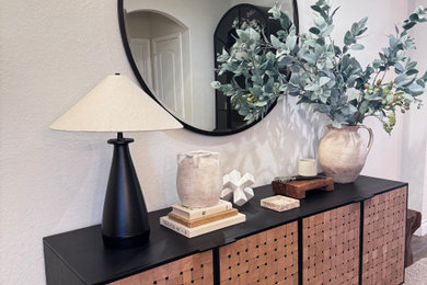 Example of a mid-sized transitional brown floor foyer design in Austin with white walls