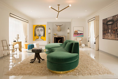 Photo of a contemporary living room in Los Angeles with white walls and a standard fireplace.