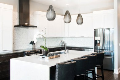 Inspiration for a large transitional l-shaped separate kitchen in Orange County with an undermount sink, shaker cabinets, white cabinets, quartz benchtops, white splashback, mosaic tile splashback, stainless steel appliances, dark hardwood floors and with island.