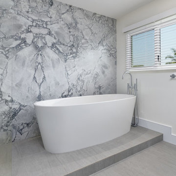 Contemporary Master Bathroom with striking features