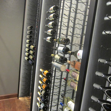 Iron Wine Racks for a Sturdy and Sleek Wine Cellar Design in Texas