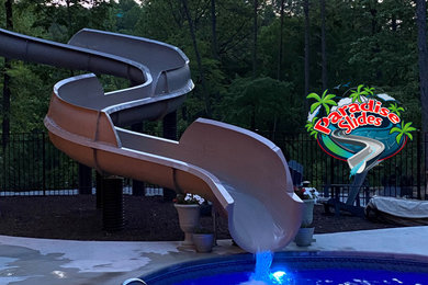 Large arts and crafts backyard natural water slide photo in Atlanta