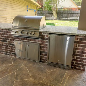 Stone Patio with Outdoor Kitchen and Pool