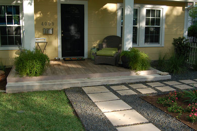 Mid-sized minimalist concrete paver front porch idea in Austin