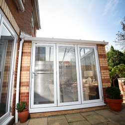 White Conservatory with PVCu Bi-Fold Doors - Products