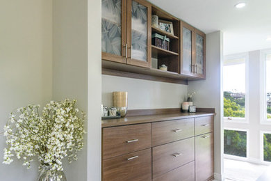 Inspiration for a large transitional master ceramic tile bathroom remodel in Hawaii with flat-panel cabinets, white walls, dark wood cabinets and solid surface countertops