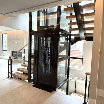 Project #136 | Modern Floating Staircase Encircling Glass Elevator