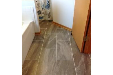Mid-sized elegant master vinyl floor and gray floor bathroom photo in Cleveland with beaded inset cabinets, medium tone wood cabinets and white walls
