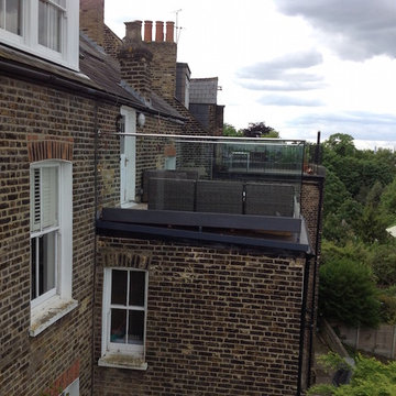 Balcony Transformation with Glass Balustrade and Composite Decking