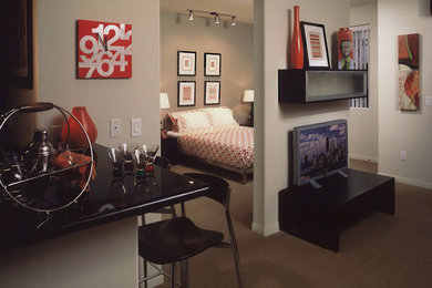 Trendy carpeted bedroom photo in Los Angeles with gray walls