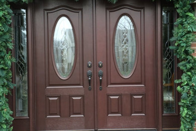 Inspiration for a large timeless entryway remodel in Philadelphia with a dark wood front door