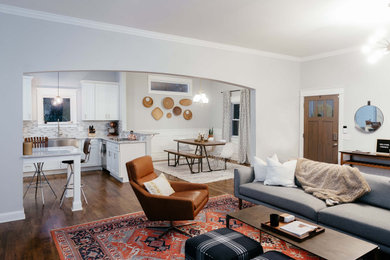 Living room - large eclectic open concept medium tone wood floor and brown floor living room idea in Nashville with gray walls