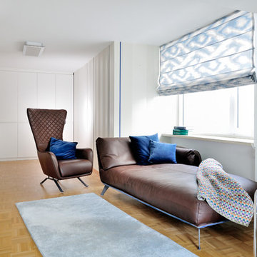 Braune Ledercouch und Sessel