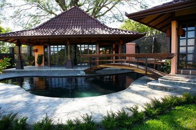 Inspiration for a tropical exterior home remodel in Other
