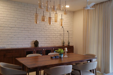 Design ideas for an eclectic dining room in Bengaluru.