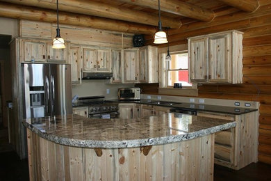 Mid-sized mountain style l-shaped kitchen photo in Boise with shaker cabinets, distressed cabinets, granite countertops, stainless steel appliances and an island