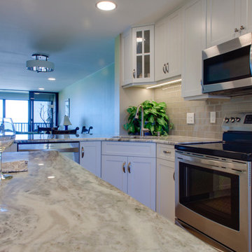 LED under cabinet lighting highlights the glass backsplash