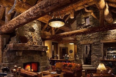 Inspiration for a mid-sized rustic formal and enclosed dark wood floor living room remodel in Charlotte with brown walls, a standard fireplace, a stone fireplace and no tv