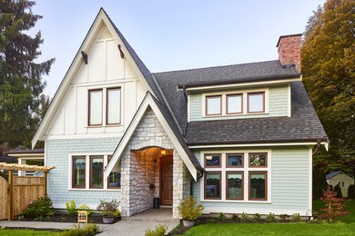 Large traditional green three-story concrete fiberboard and clapboard exterior home idea in Vancouver with a shingle roof and a black roof