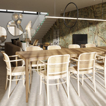 Faro dining room with rattan chairs and stair view
