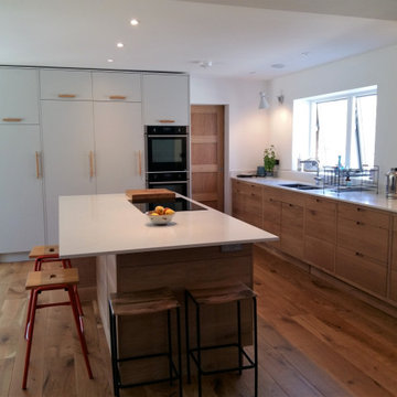 Oak and light grey modern open plan kitchen