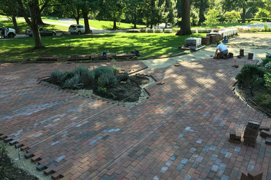 Inspiration for a craftsman concrete paver landscaping in Kansas City.