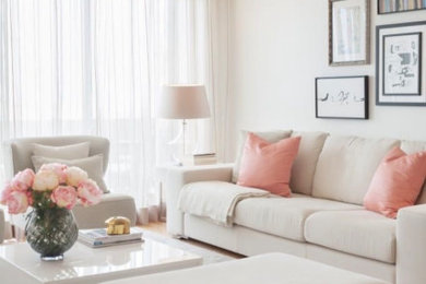 This is an example of a large transitional formal enclosed living room with light hardwood floors, no fireplace and no tv.