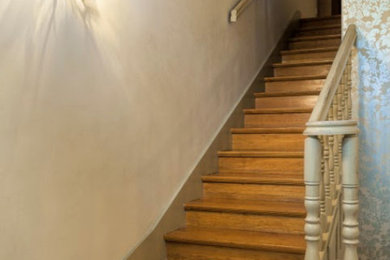 Inspiration for a mid-sized timeless wooden straight wood railing staircase remodel in Salt Lake City with wooden risers