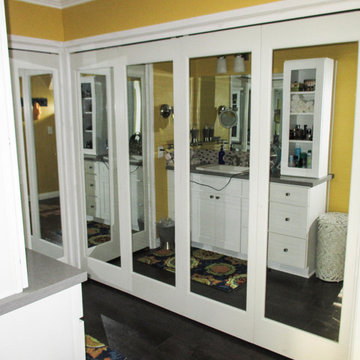 Bi-Folding Mirror Ovation Closet Doors in a Bathroom