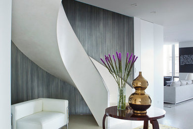 Inspiration for a large modern foyer in New York with grey walls and white floor.