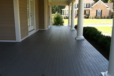 Large minimalist front porch photo in Other with decking and a roof extension