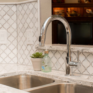 Kitchen | Two-Tone Cabinets | Cambria Quartz | Arabesque Marble Backsplash