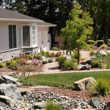 FRONT YARD WITH TREES AND DRY-CREEK