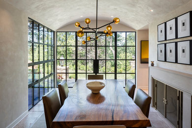Inspiration for a mid-sized transitional beige floor enclosed dining room remodel in Kansas City with white walls and a stone fireplace