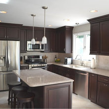 Quartz countertop with fridge next to stove