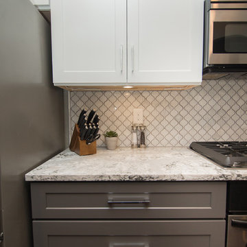 Kitchen | Two-Tone Cabinets | Cambria Quartz | Arabesque Marble Backsplash