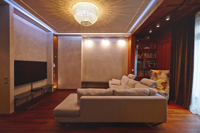На фото: гостиная комната в современном стиле с с книжными шкафами и полками и телевизором на стене