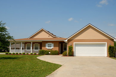 Example of a mid-sized minimalist brown house exterior design in Atlanta with a shingle roof and a brown roof
