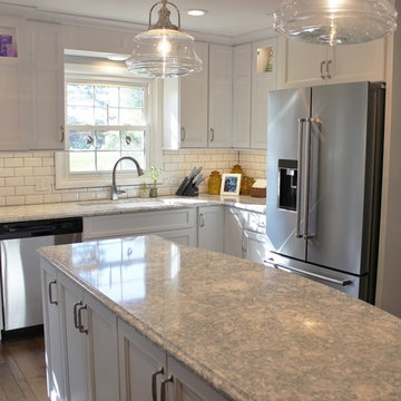 Atkinson, IL- Ranch Home Remodel With Bright White Cabinets and Brick Wall